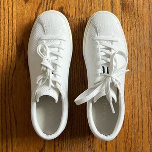 Rothy’s bright white & cream sneaker size 6.5. Cute navy stripes down back heel.